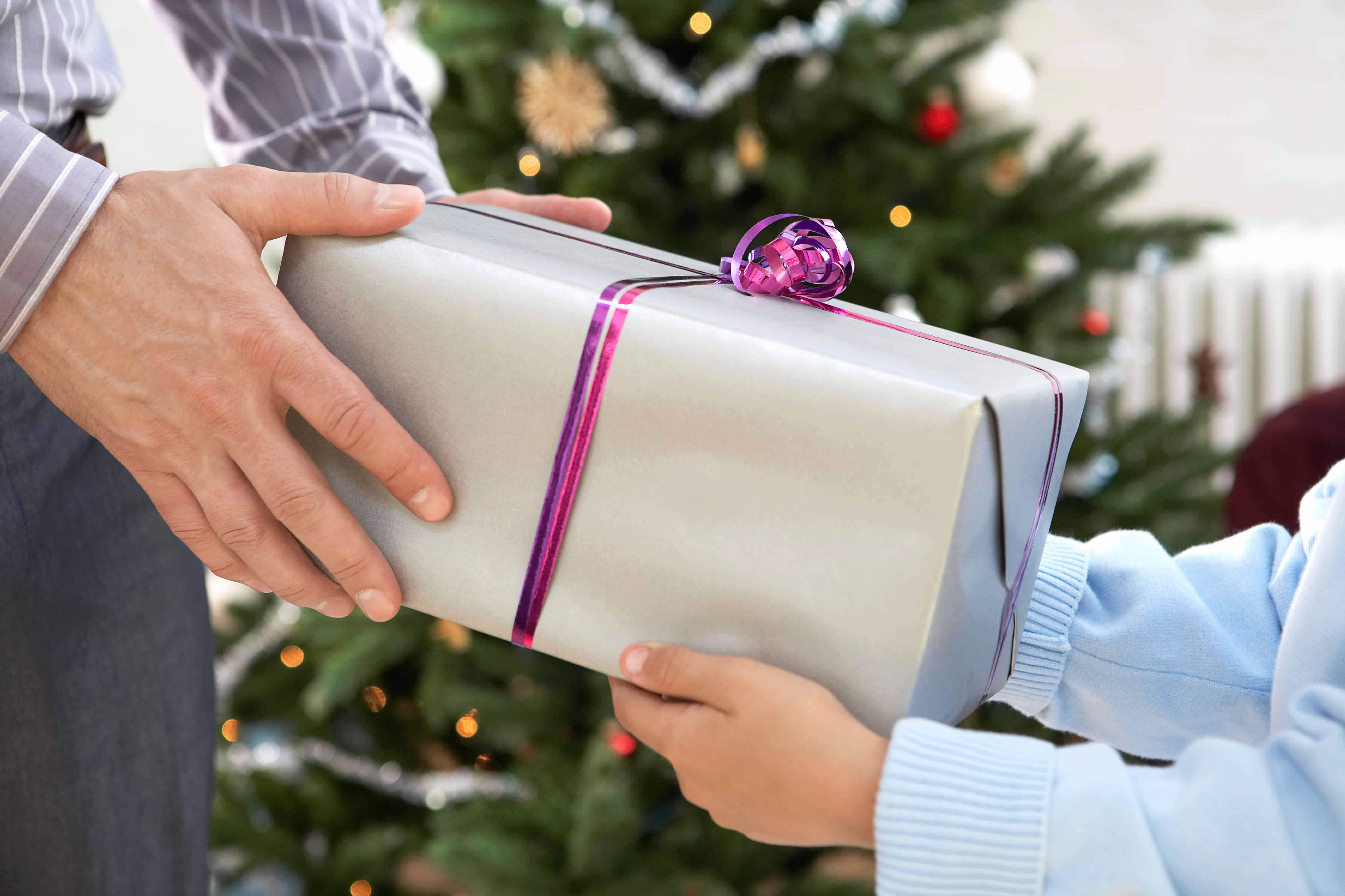 Father giving son gift at Christmas