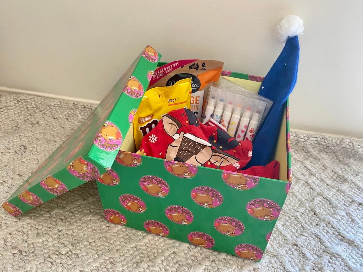 a christmas box filled with gifts for 1st of december