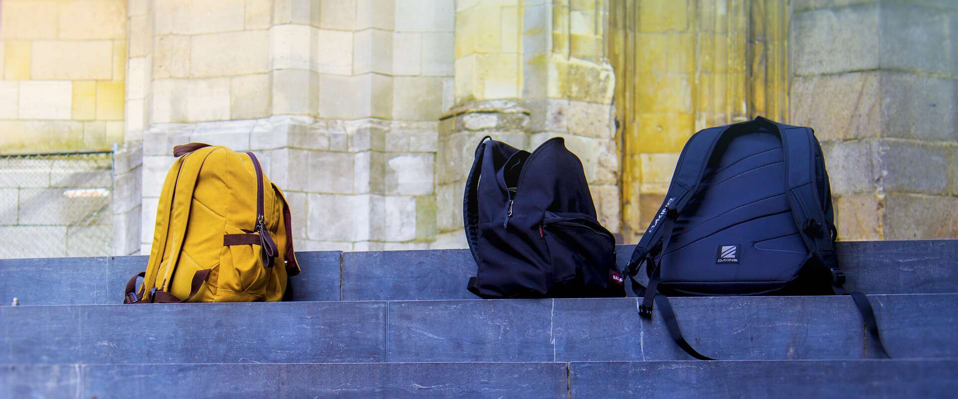 school backpacks on steps