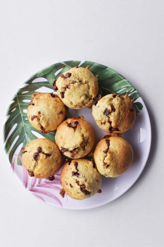 banana muffins with chocolate chips on a plate.