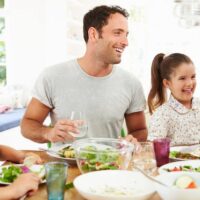 family eating dinner and talking together