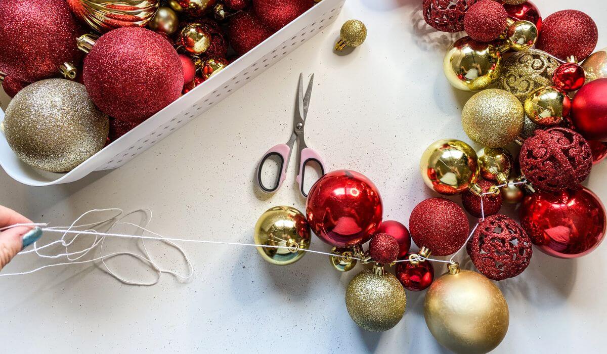 making a garland from baubles