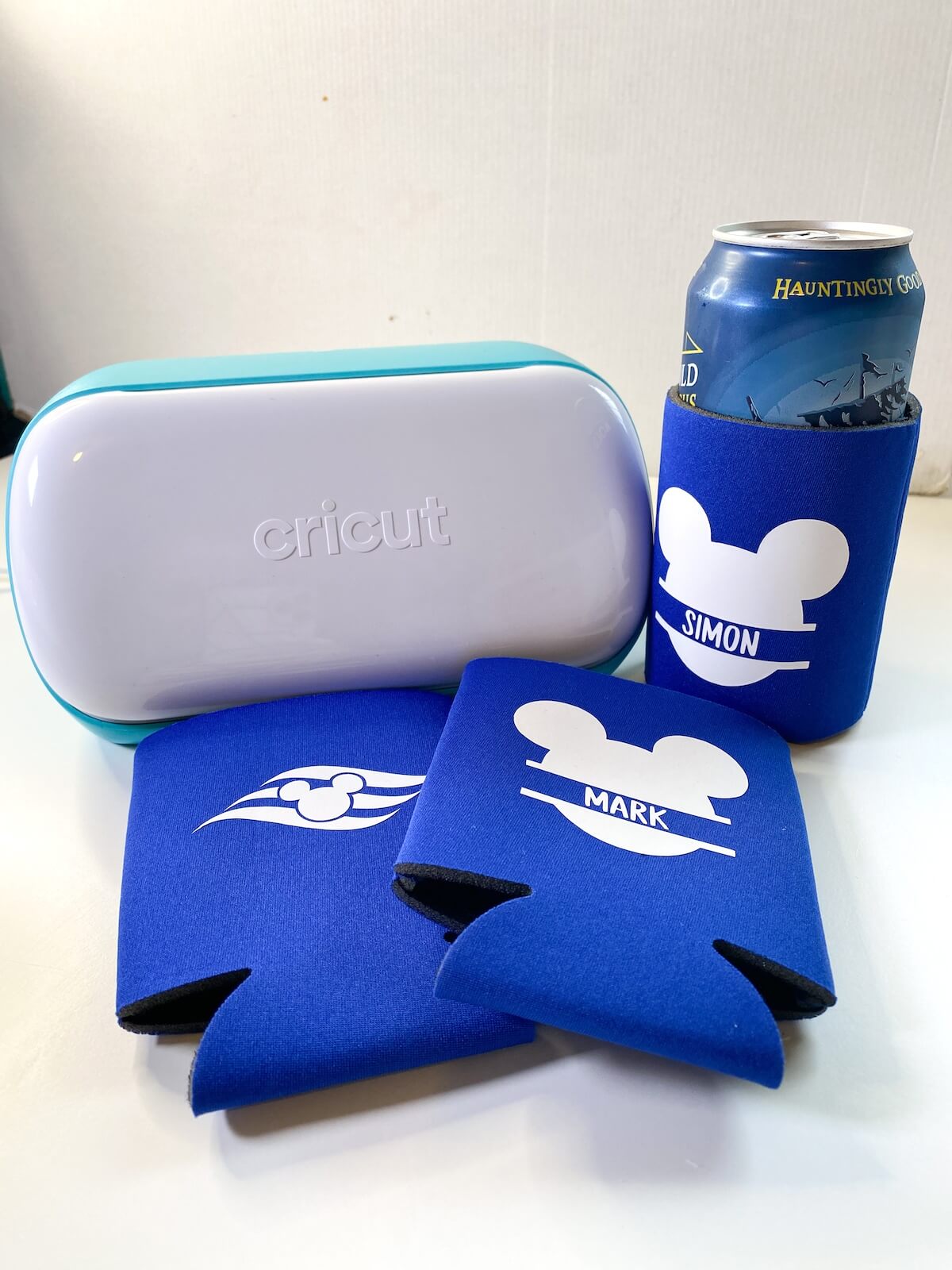 DIY can koozies with a cricut joy and one cooler with a beer can inside.