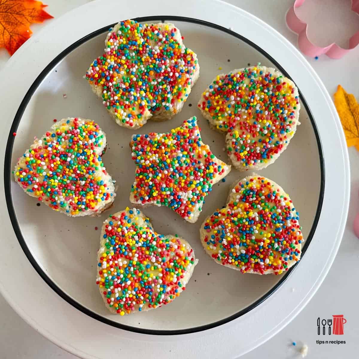 mini fairy bread sandwiches on a plate