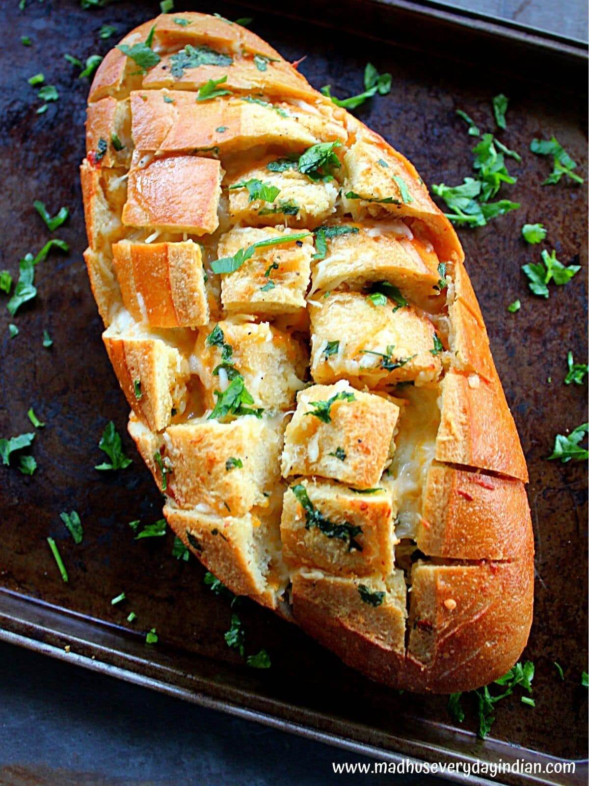 cheese and garlic pull apart bread on a tray