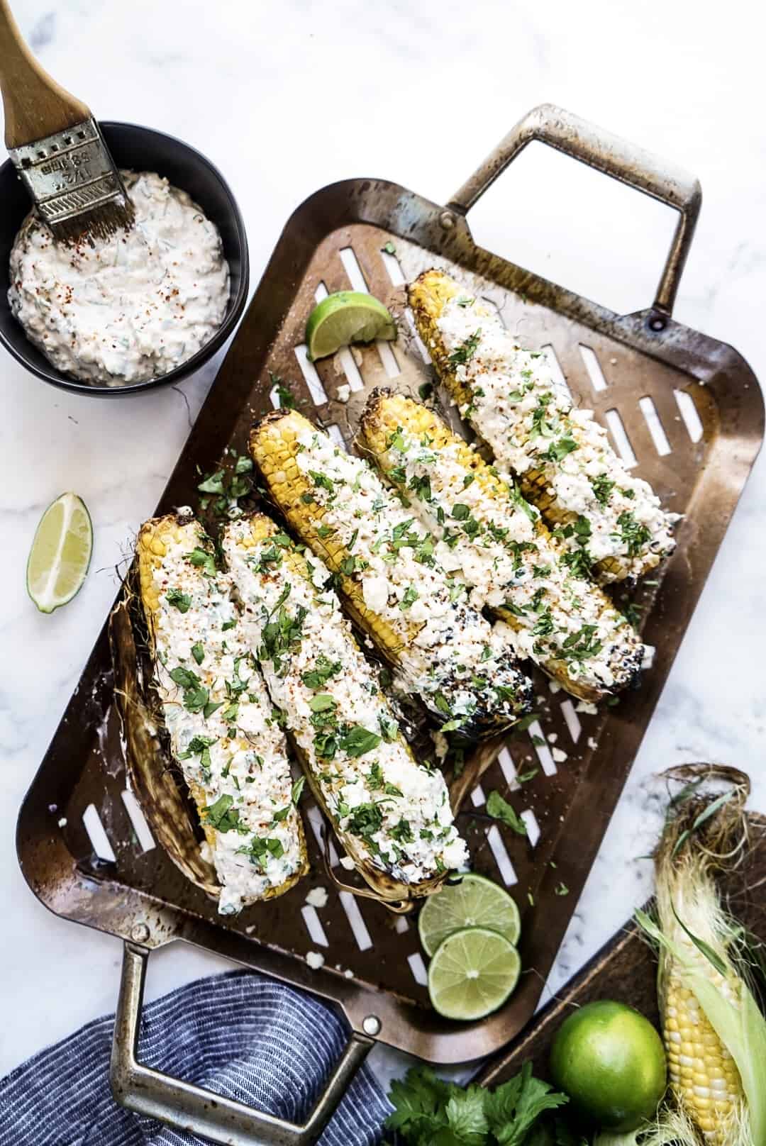 grilled Mexican street corn on a grill plate