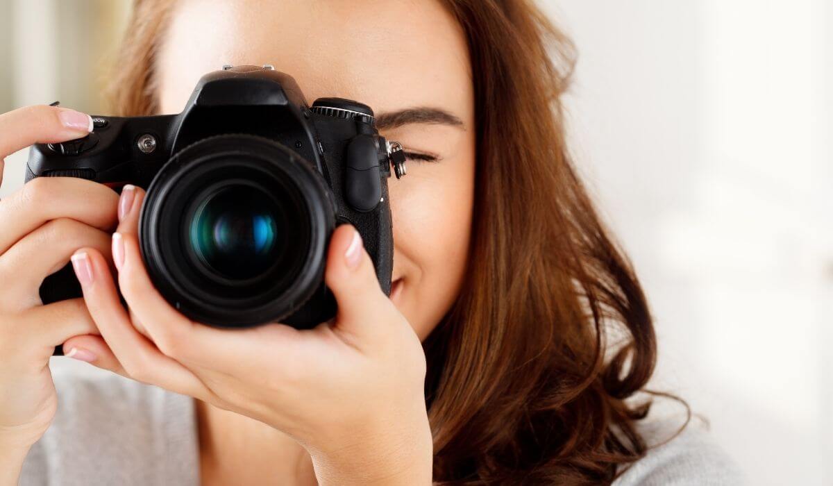 woman with a camera learning photography