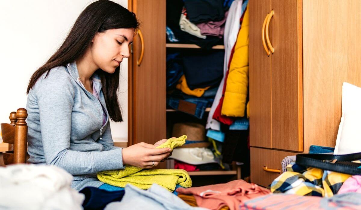 woman decluttering closet