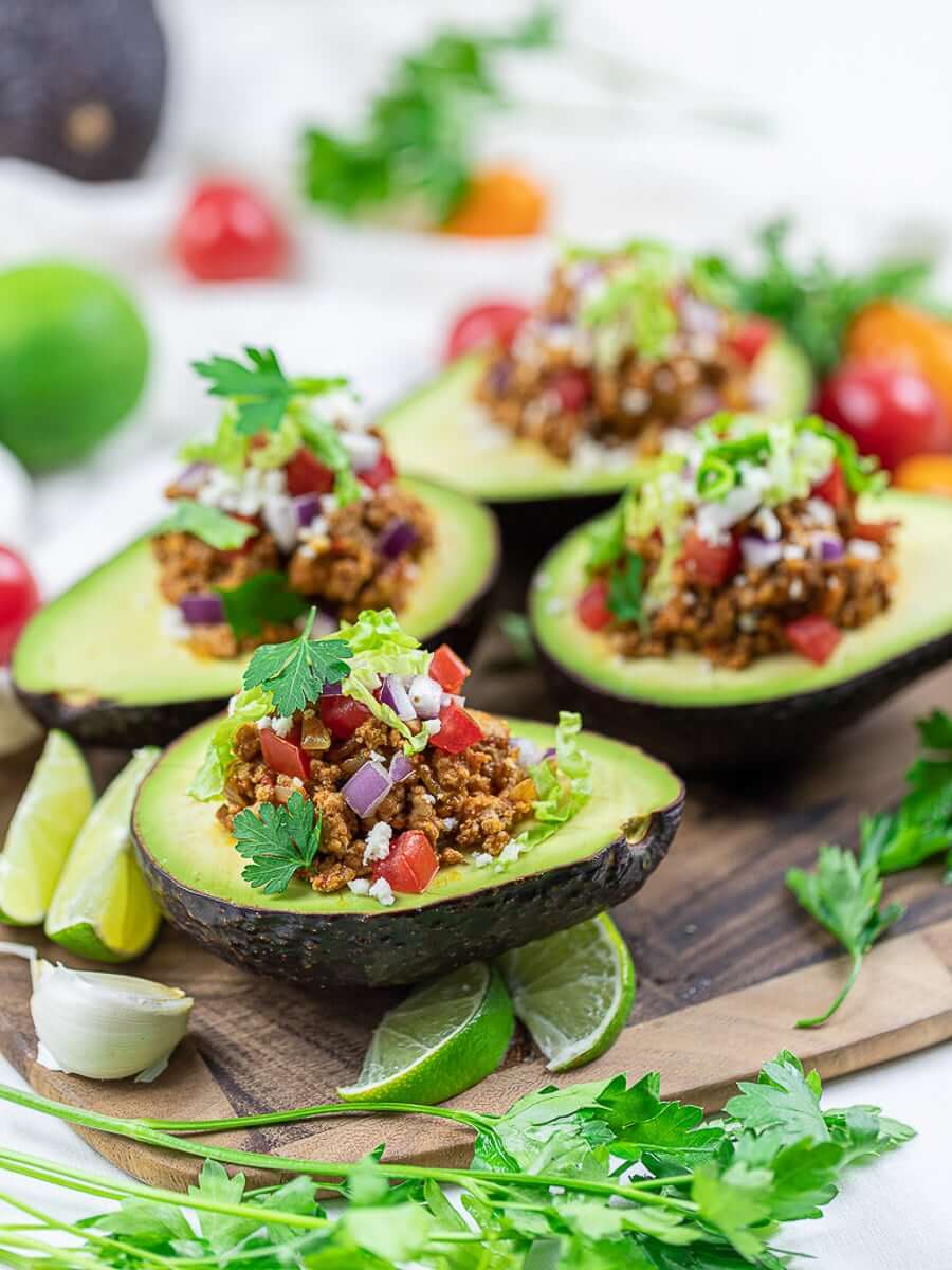 avocado boats on a wooden tray