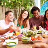 lunch party with a group of friends dining outdoors