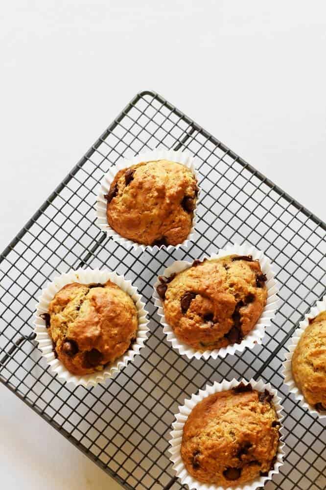 Banana chocolate chip muffins on a cooling rack looking down.