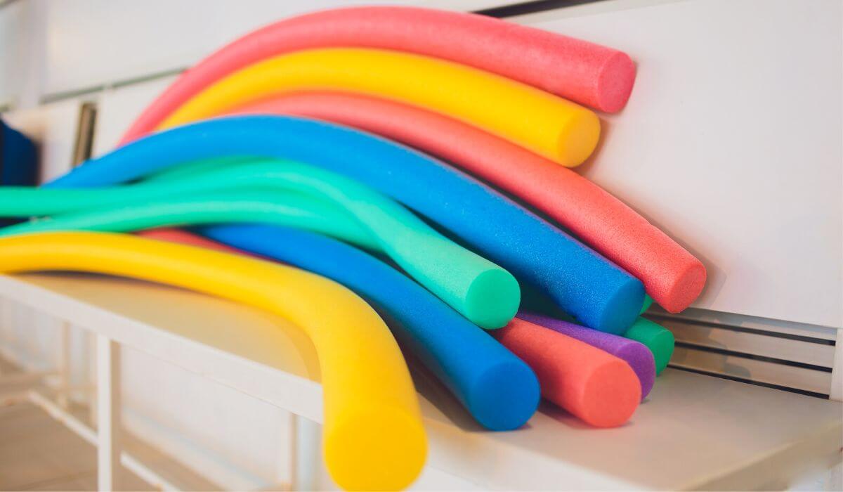 pool noodles on a shelf