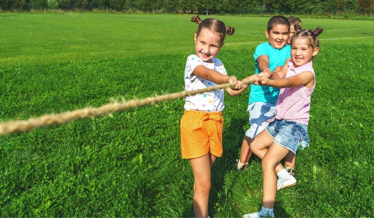 kids playing tug of war outside