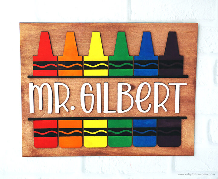 wooden teacher sign with wooden crayon shapes and mrs gilbert wording