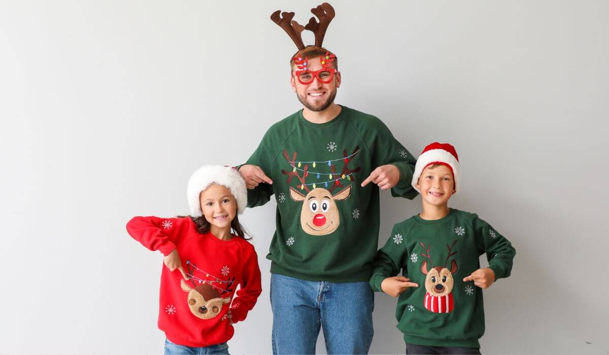 family wearing ugly christmas sweaters