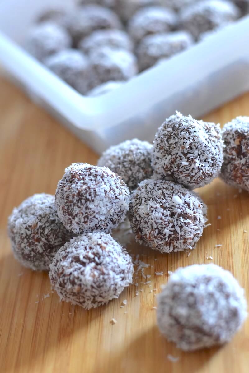 Rum balls on a wooden serving platter