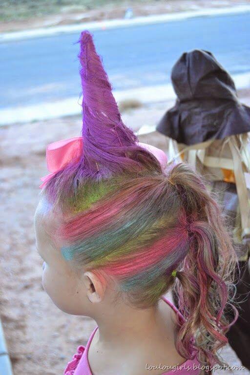 unicorn horn hairstyle with rainbow coloured hair chalk.