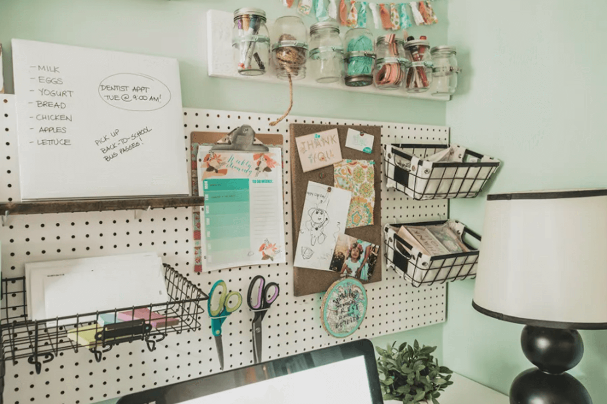 pegboard family command center in craft room area