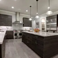 dark kitchen with marble benchtops