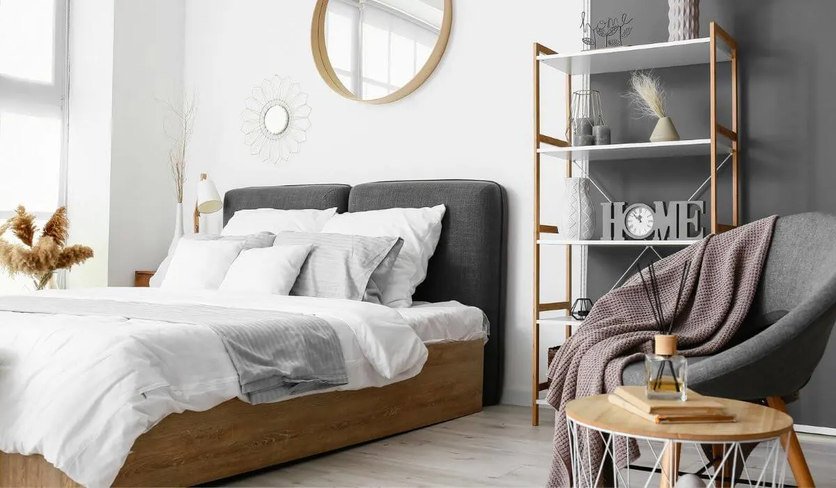 tidy bedroom with decorative chair and shelf