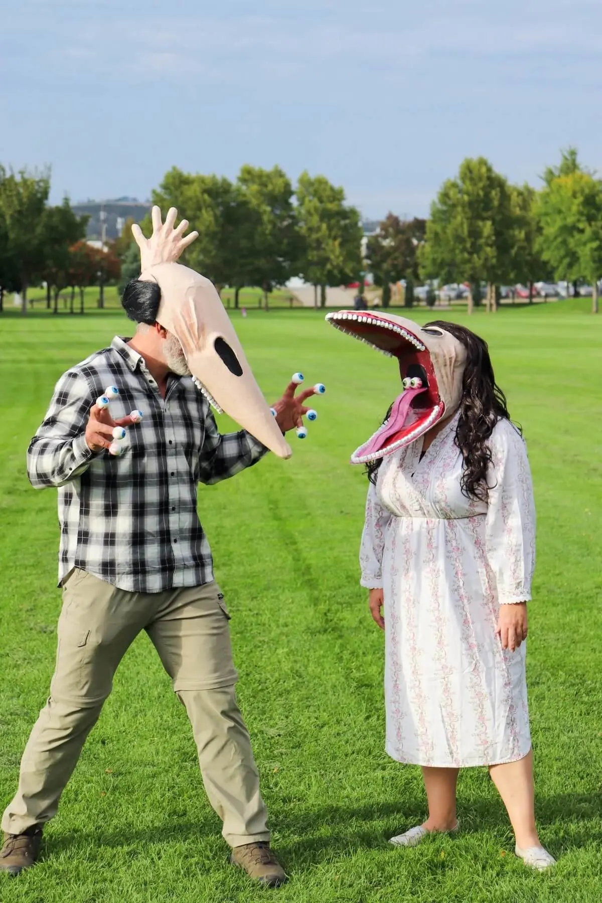 man and woman dressed as monsters from beetlejuice movie