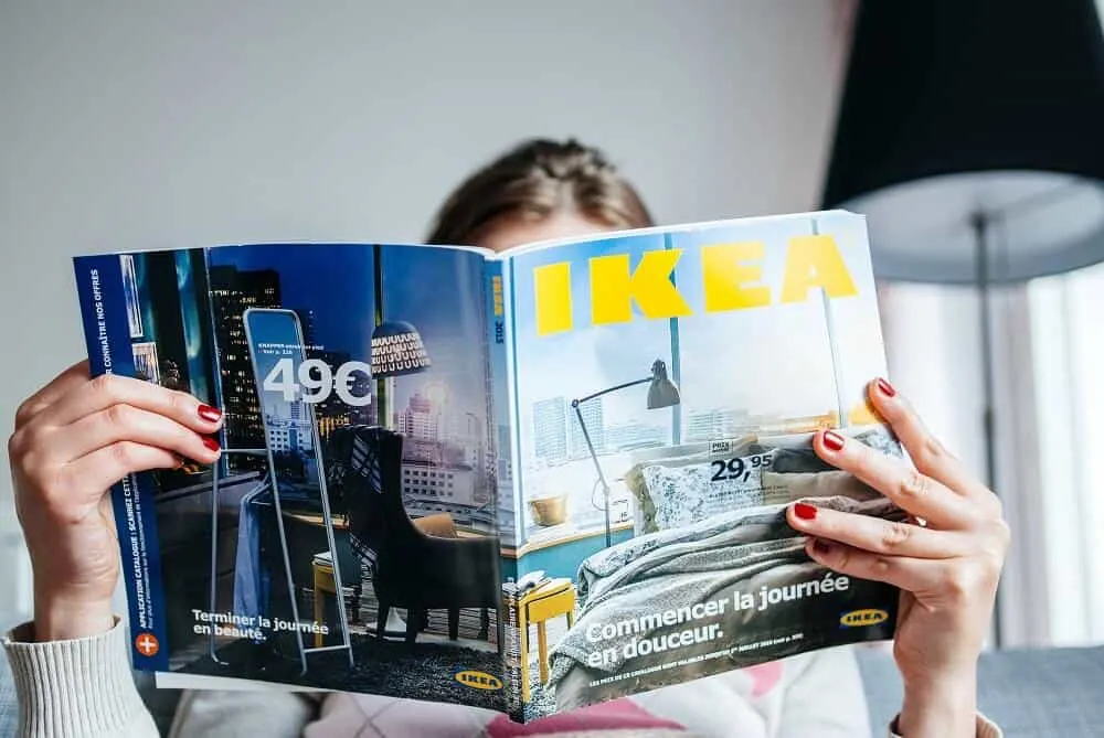 Woman reading ikea catalogue