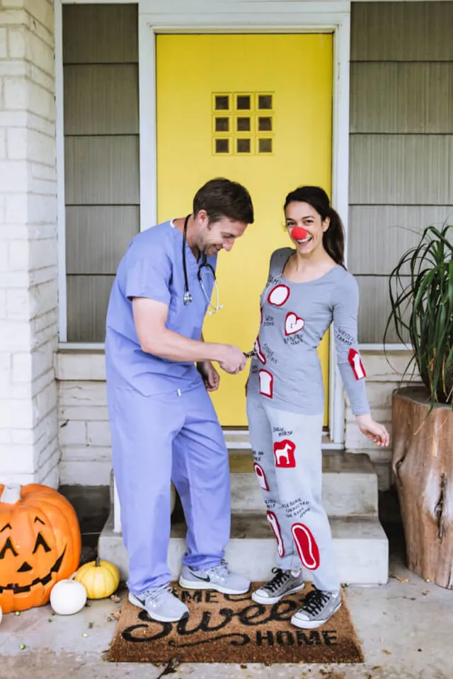 man and woman dressed as doctor in scrubs and the board game operation