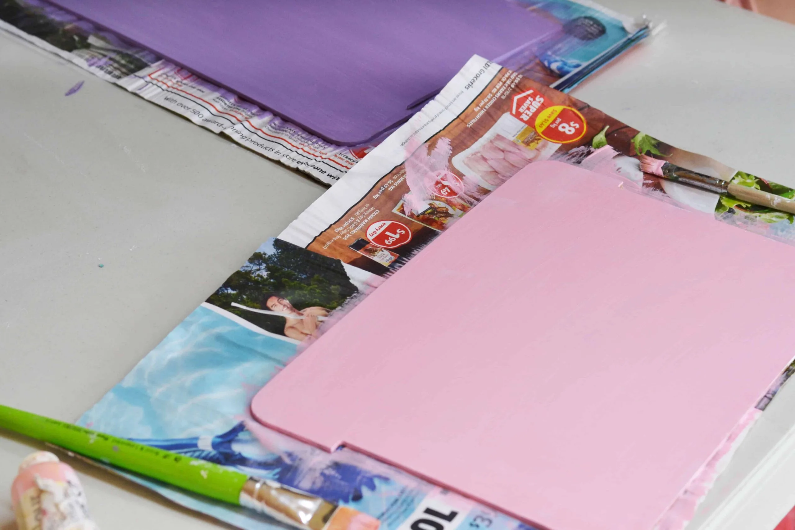 Painting the back panels on a wooden money box