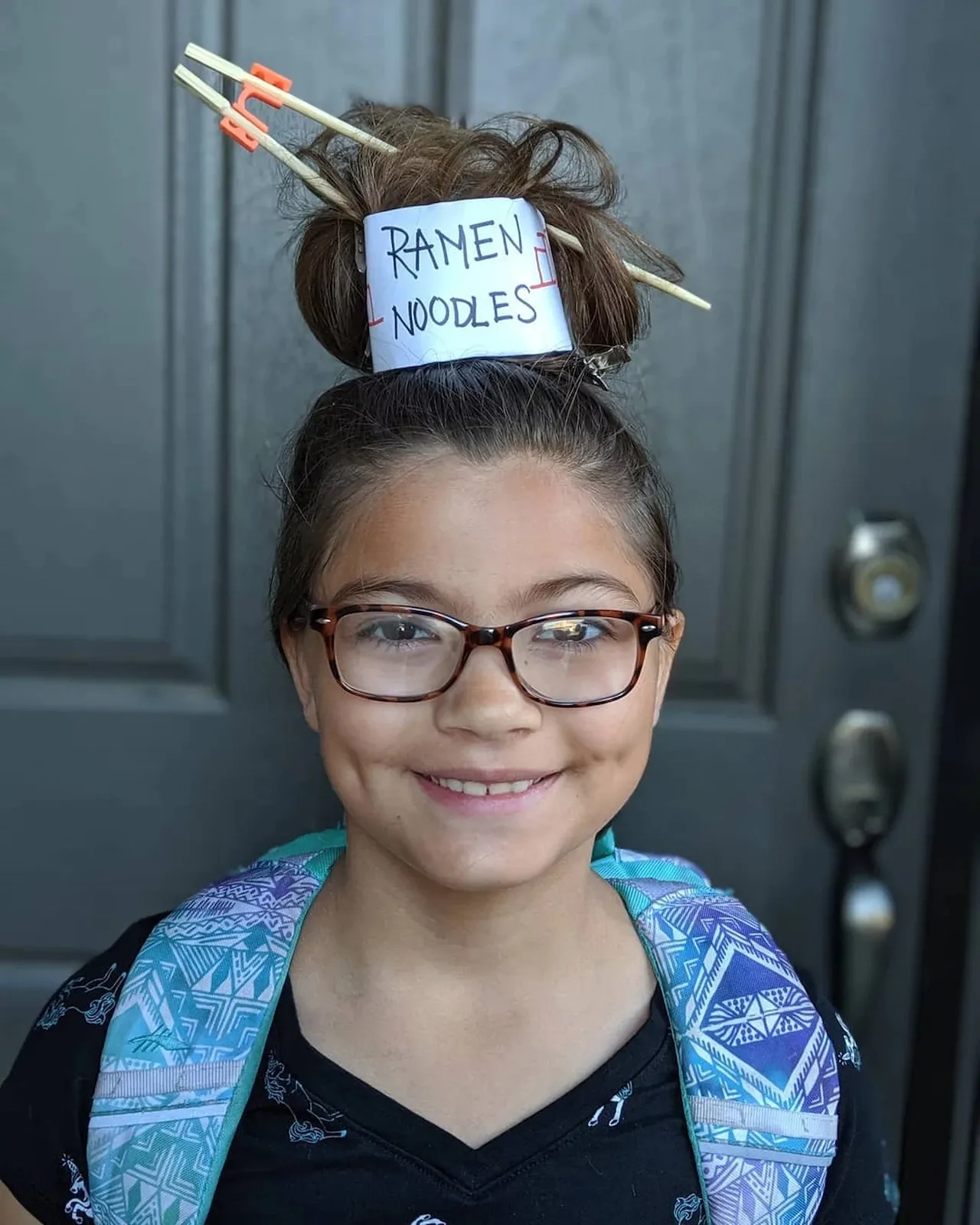 little girl with ramen noodles crazy hair style.