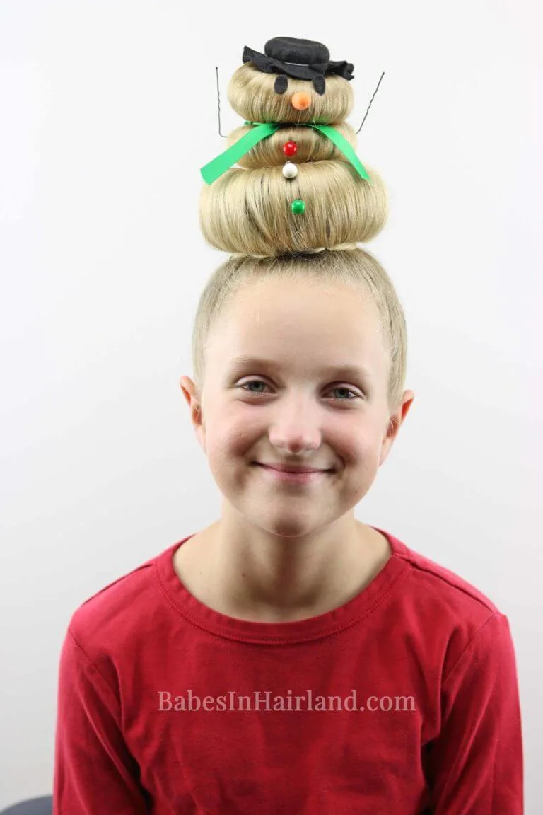 snowman buns with three stacked buns on top of the head and snowman decorations. 