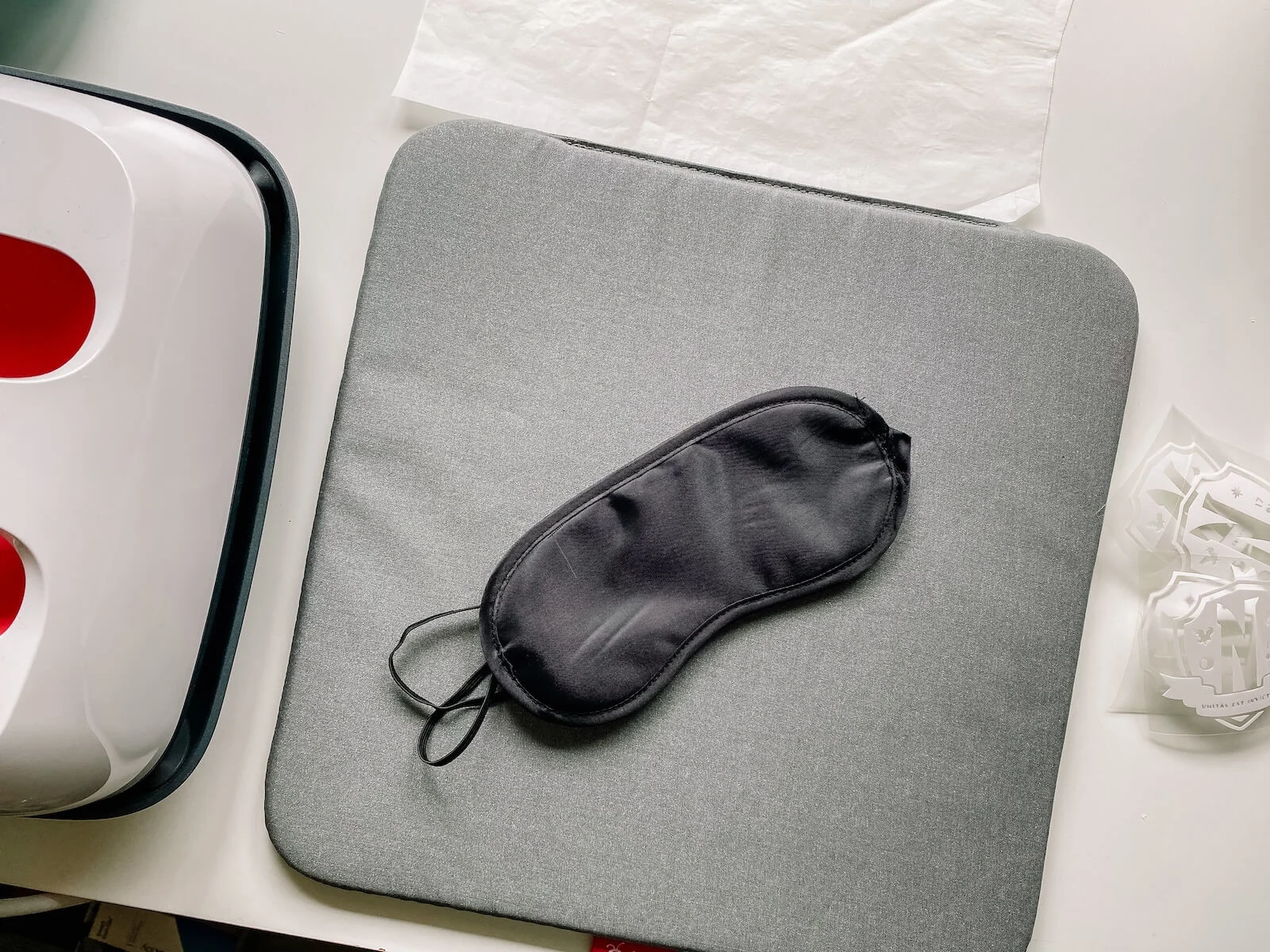 blank black sleeping mask on a cricut heatpress mat.